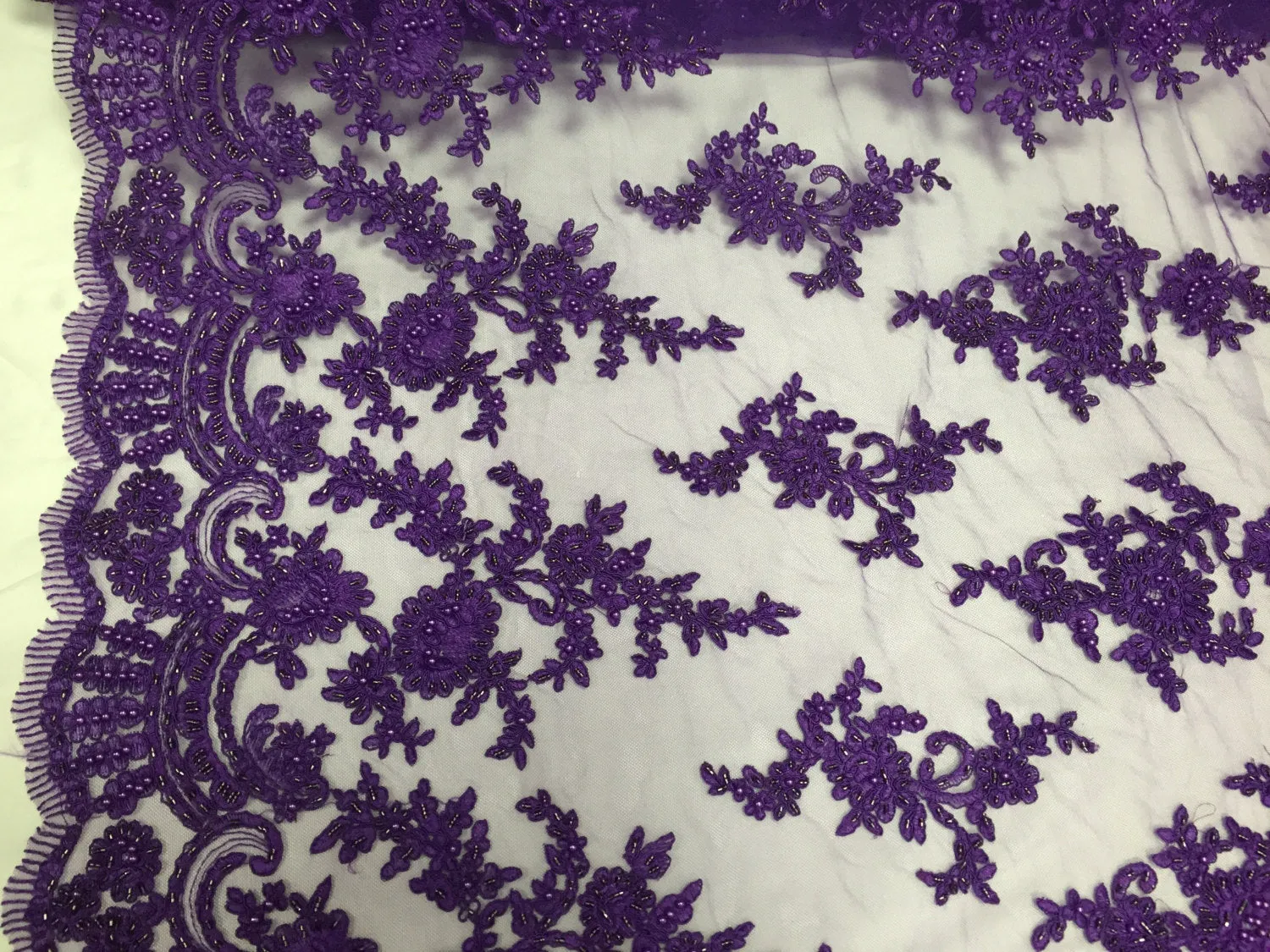Purple appealing flower design embroider and beaded on a mesh lace-prom-nightgown-decorations-dresses-sold by the yard.