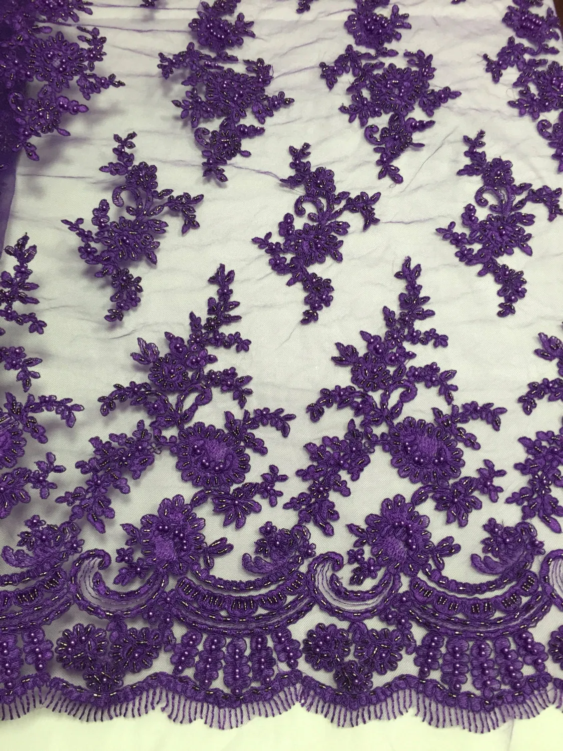 Purple appealing flower design embroider and beaded on a mesh lace-prom-nightgown-decorations-dresses-sold by the yard.