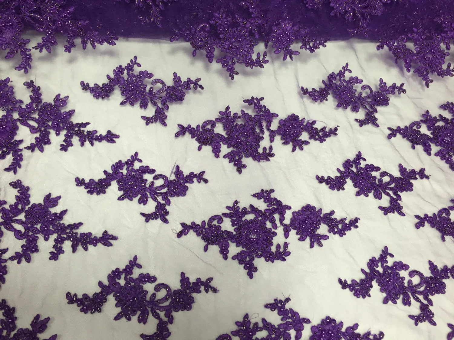 Purple appealing flower design embroider and beaded on a mesh lace-prom-nightgown-decorations-dresses-sold by the yard.