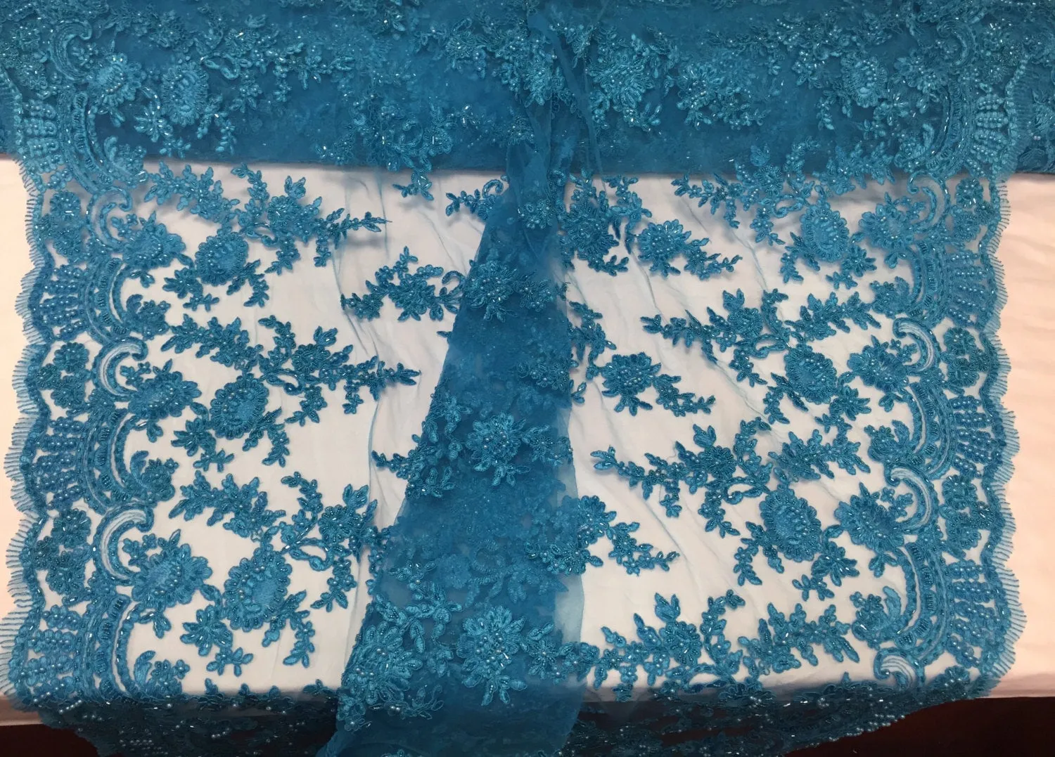 Turquoise appwaling flower design emboider and beaded on a mesh lace-prom-nightgown-decorations-dresses-sold by the yard.