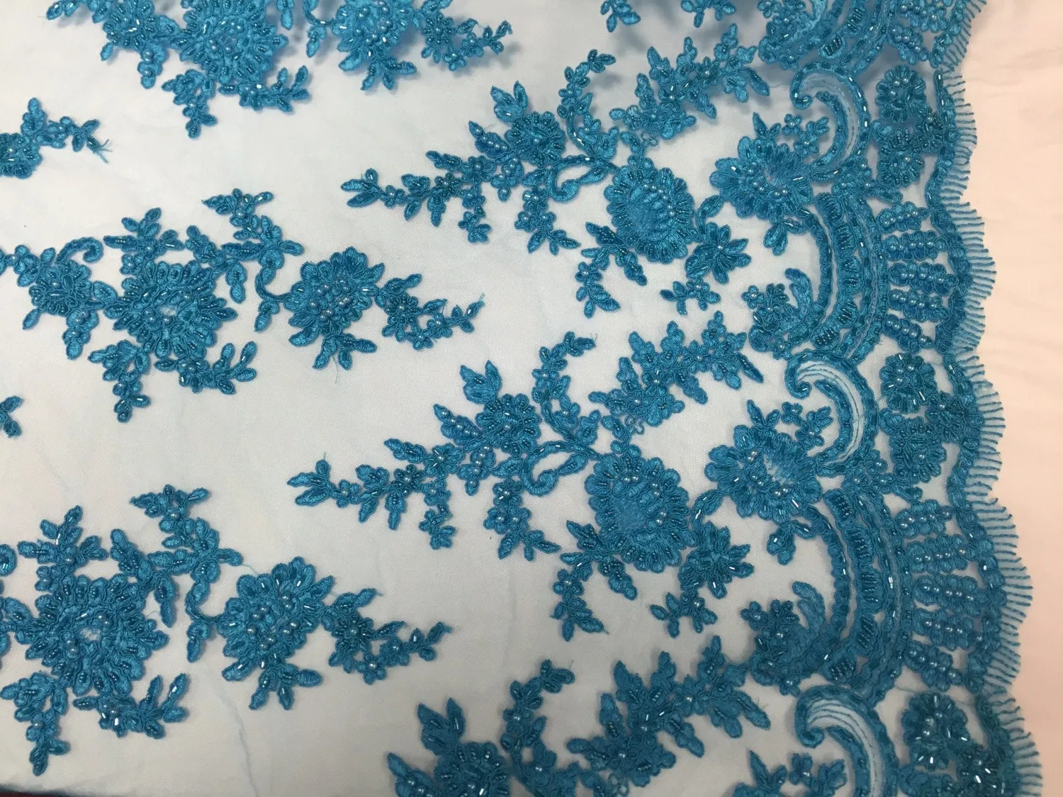 Turquoise appwaling flower design emboider and beaded on a mesh lace-prom-nightgown-decorations-dresses-sold by the yard.
